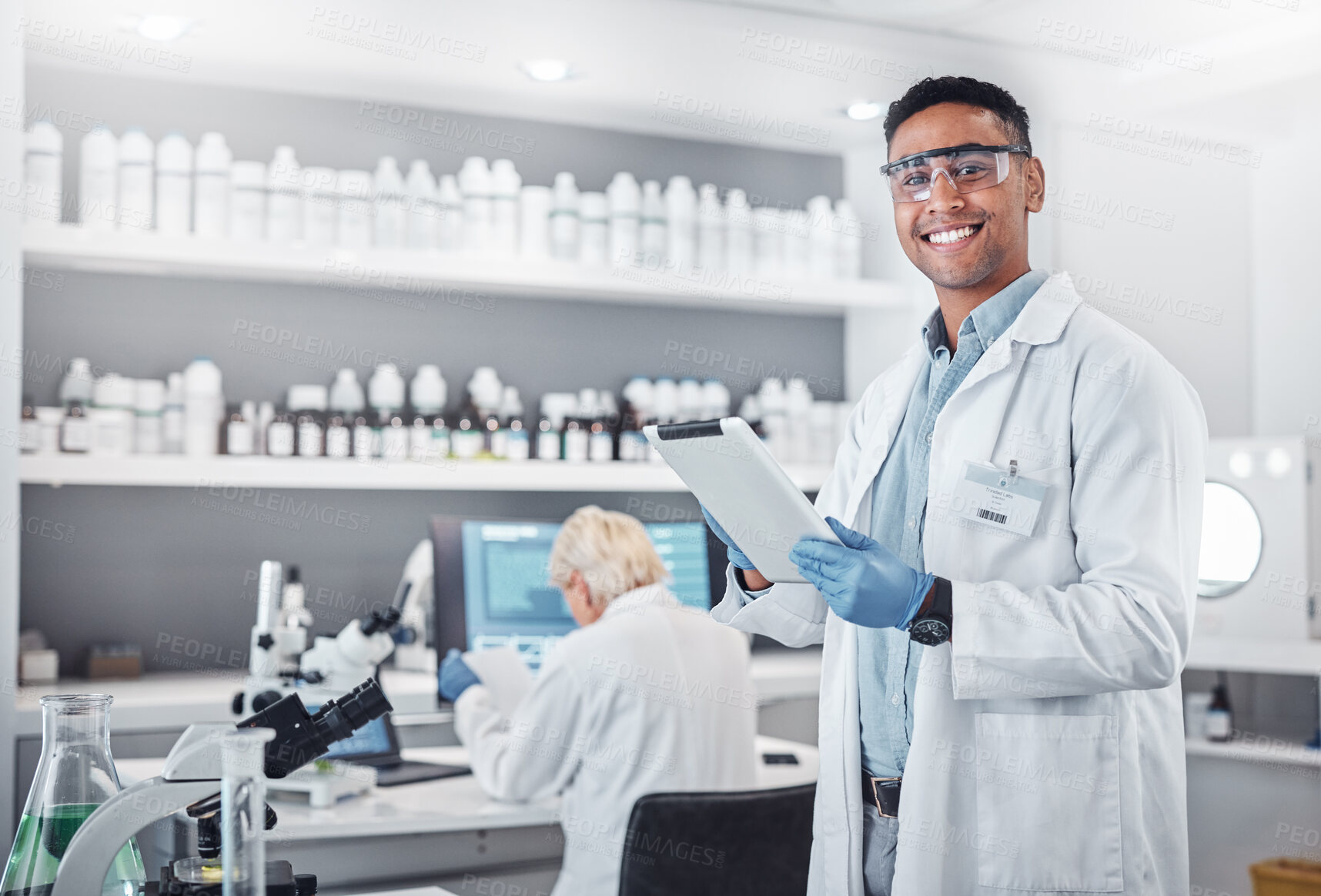 Buy stock photo Science, tablet and portrait of a male scientist doing research with technology in a medical laboratory. Happy, smile and man chemist or biologist working on a mobile device in a pharmaceutical lab.