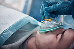 Anesthesia, oxygen mask and medical with man in surgery for breathing, ventilation and operation. Healthcare, cardiology and paramedic with face of patient and doctors in operating room for emergency