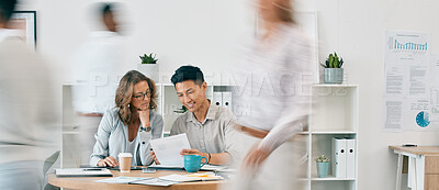 Buy stock photo Teamwork, documents and business people in office for review or discussion. Paperwork, collaboration or Asian man and woman at desk in busy workplace planning sales, advertising or marketing strategy