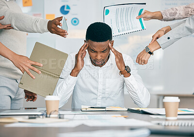 Buy stock photo Stress, burnout and tired black man with headache, frustrated or overwhelmed by coworkers at workplace. Overworked, mental health and anxiety of exhausted male worker multitasking at desk in office.