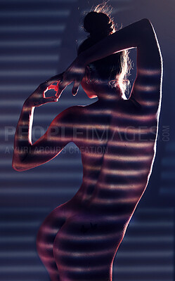 Buy stock photo Sensual, blinds and woman posing in a studio with an alluring, sexy and seductive pose with light. Beautiful, slim and boy of a female model with a stripe pattern isolated by a dark black background.