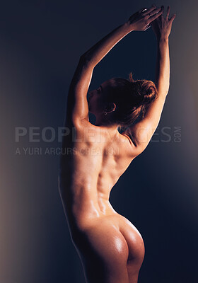 Buy stock photo Naked, woman and butt in studio, sexy and dark for sensual beauty, skincare and fitness by backdrop. Model, nude and ass with glow, sexual wellness and erotic aesthetic with body by black background