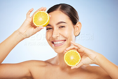 Buy stock photo Woman, skincare portrait and lemon for beauty, health and wellness with vitamin c, happy and smile. Model, fruit and happiness for self care, clean radiant glow and skin by blue background in studio