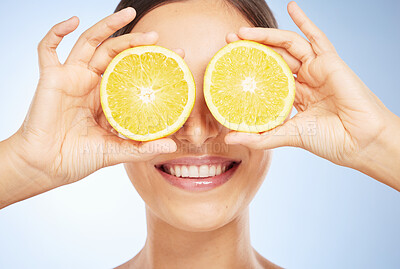 Buy stock photo Beauty, lemon and woman with face and natural product, organic and vegan facial detox for skin against studio background. Hands, teeth and lips, cosmetic care with citrus and vitamin c for skincare.