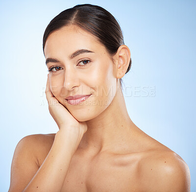 Buy stock photo Portrait, skincare and beauty with a model woman in studio on a blue background for natural treatment. Face, wellness and luxury with an attractive young female posing to promote a skin care product