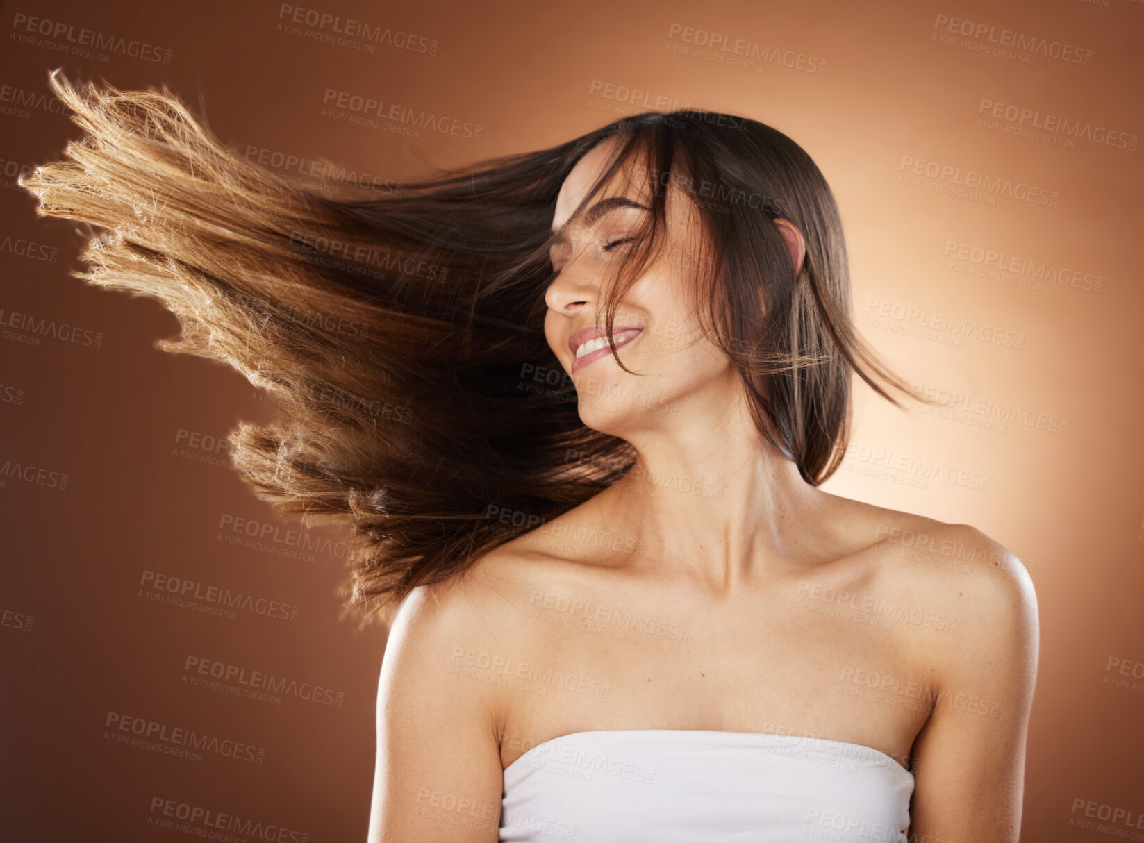 Buy stock photo Hair, beauty and skincare with a model woman in studio on a brown background for natural or keratin treatment. Face, haircare and salon with an attractive young female posing to promote a product