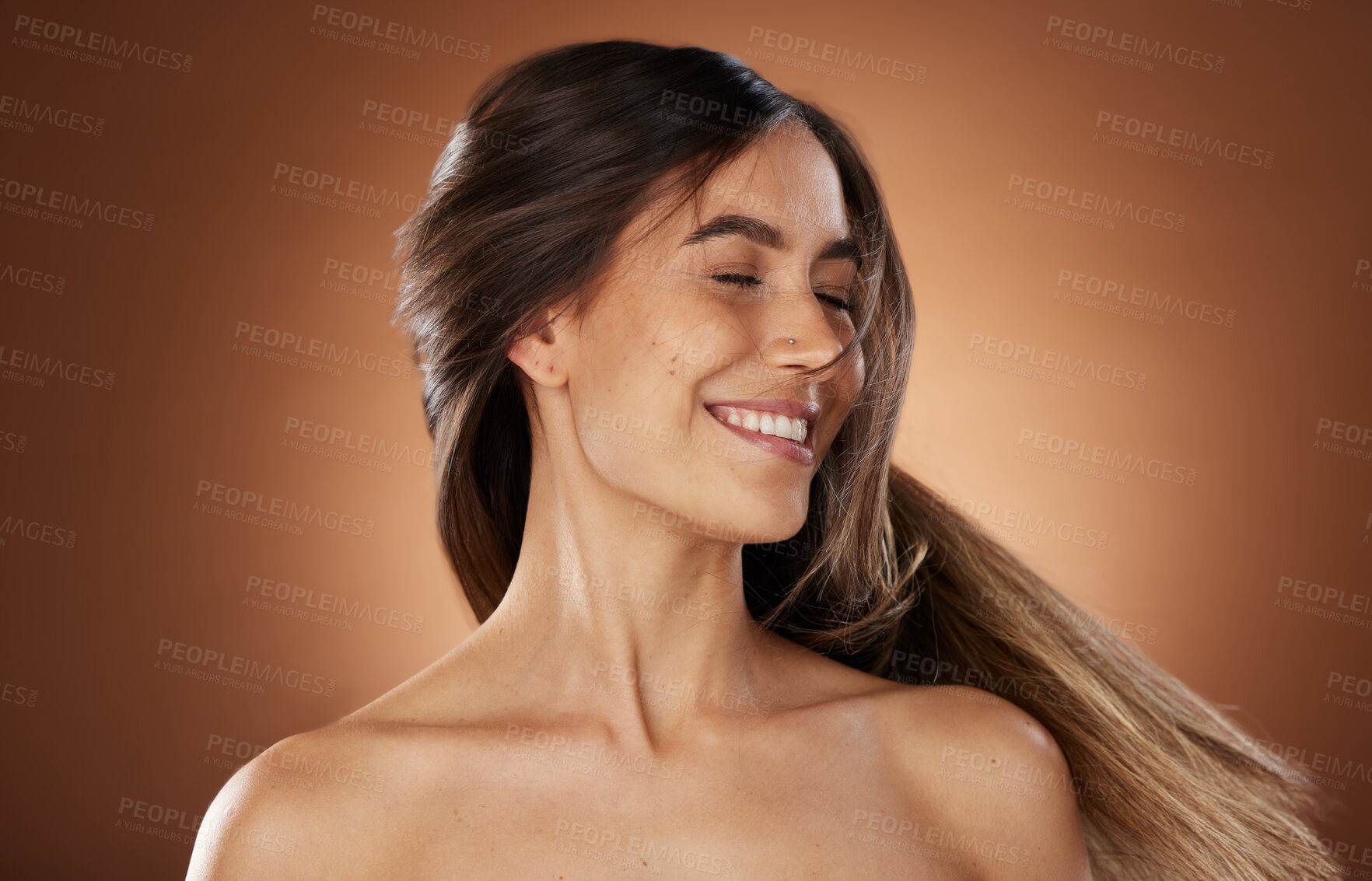 Buy stock photo Hair, beauty and skincare with a model woman in studio on a brown background for natural or keratin treatment. Face, haircare and salon with an attractive young female posing to promote a product