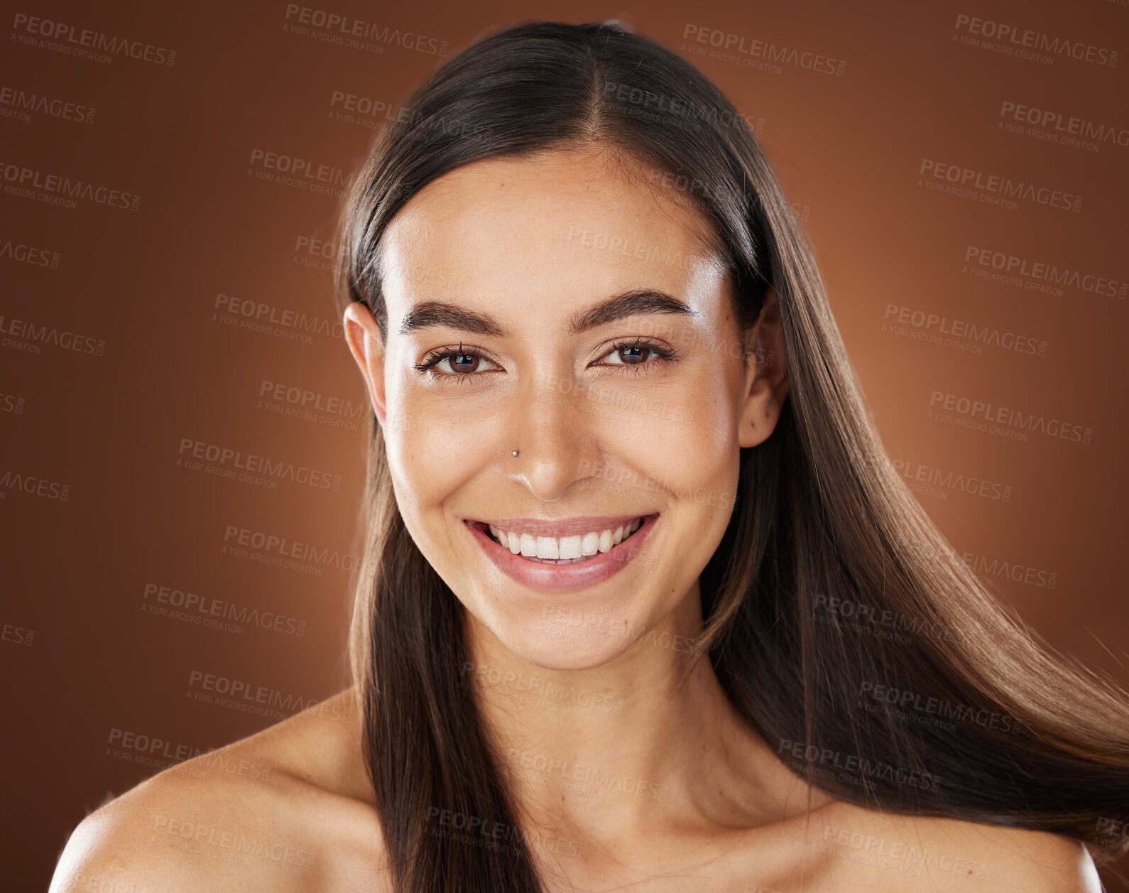 Buy stock photo Hair, beauty and portrait of woman in studio for wellness, hair treatment and shampoo products. Hair salon, hair care aesthetic and girl face with healthy, natural and long hair on brown background