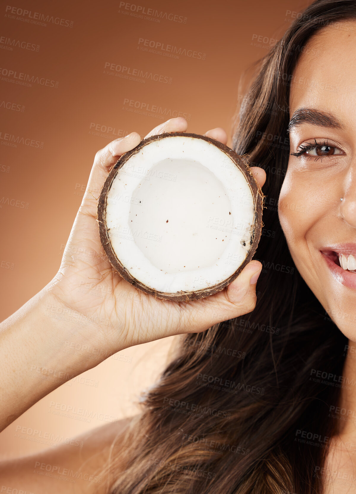 Buy stock photo Coconut skincare woman, smile and studio with happy self care, fruit nutrition or cosmetic health. Model, skin wellness or beauty for coconut oil, moisturizer or cosmetics background for natural glow