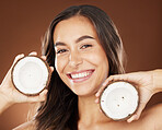 Face, beauty skincare and woman with coconut in studio on a background. Wellness, organic cosmetics and portrait of female model with fruit, product or food for healthy diet, nutrients or coconut oil