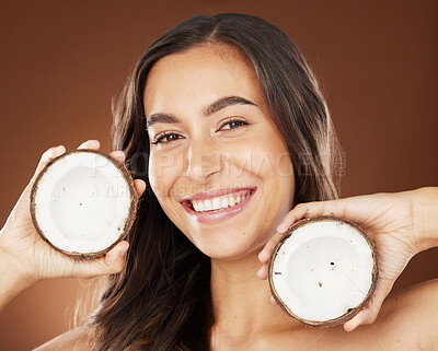 Buy stock photo Face, beauty skincare and woman with coconut in studio on a background. Wellness, organic cosmetics and portrait of female model with fruit, product or food for healthy diet, nutrients or coconut oil
