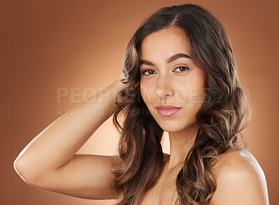 Buy stock photo Beauty, hair and salon with portrait of woman for cosmetics, fashion and luxury treatment. Wellness, hair care and shine with face of girl model for keratin, glow and self care in brown background