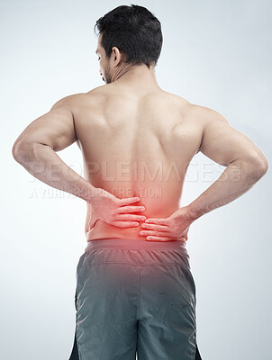 Buy stock photo Injury, back pain or man in studio with spine or hurt body problem after training isolated on studio background. Back view, red glow or person with muscle tension, body crisis or emergency accident