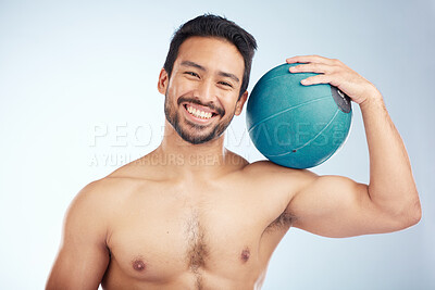 Buy stock photo Man, studio and fitness with smile, medicine ball and happiness for wellness, muscle and training goal. Model bodybuilder, portrait and happy with workout ball, exercise and body beauty by background