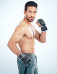 Face portrait, mma sports and man in studio on a blue background. Martial arts, body fitness and serious male fighter or boxer ready for training, workout or exercise for battle, match or competition