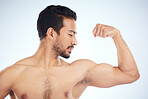Asian man, body of bicep flex on studio background in studio for muscle growth progress, healthcare wellness check or bodybuilding success. Sports athlete, coach or bodybuilder flexing arm in fitness