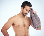 Man with towel after fitness, tired and sweat from workout with health and body care against studio background. Sports training, motivation and exhausted athlete wipe head with wellness and cardio.