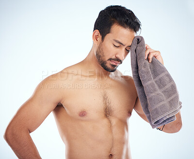 Buy stock photo Man with towel after fitness, tired and sweat from workout with health and body care against studio background. Sports training, motivation and exhausted athlete wipe head with wellness and cardio.