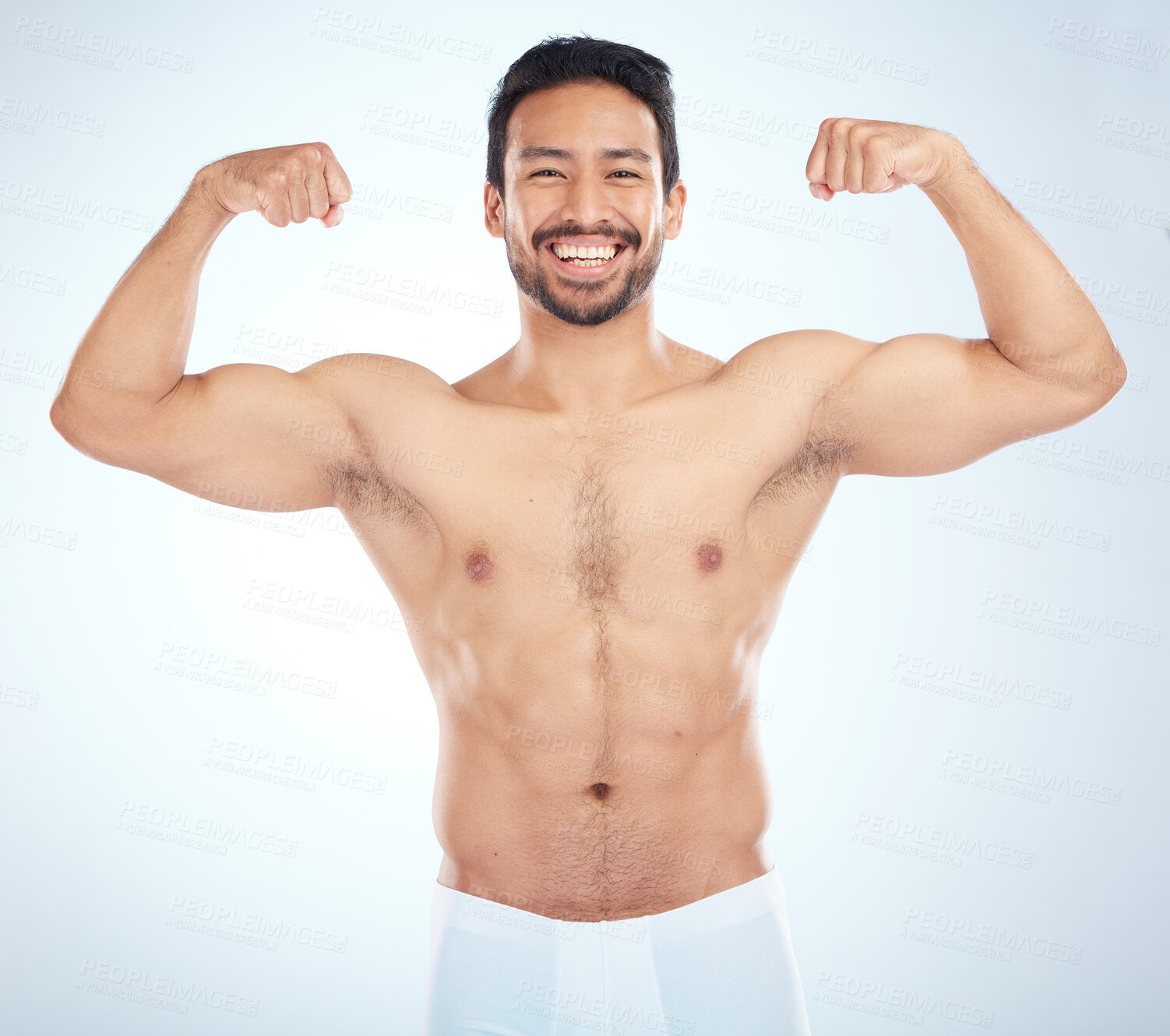 Buy stock photo Fitness, biceps and portrait of a man flexing in a studio after an arm muscle training workout. Sports, health and strong Asian male bodybuilder after a strength exercise isolated by white background
