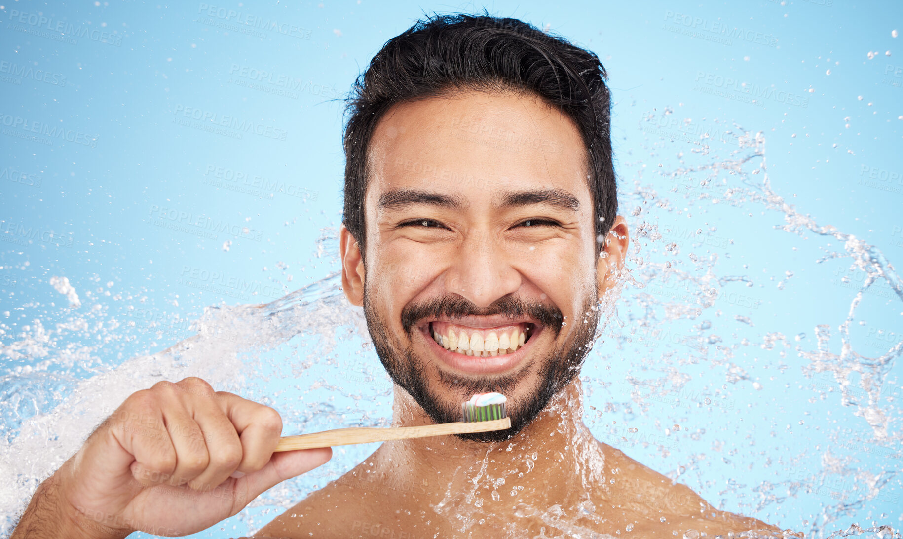 Buy stock photo Water splash, portrait or man brushing teeth in studio with toothbrush for white teeth or oral healthcare. Face, tooth paste or happy person cleaning or washing mouth with a healthy dental smile