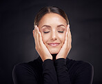 Face, beauty skincare and woman with eyes closed in studio on a dark background. Makeup, cosmetics and happy female model feeling good with hands on head after spa facial treatment for healthy skin.