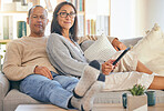 Mature couple, tablet and relax portrait on sofa together for love, support and romance bonding in living room at home. Man smile, happy woman, and romantic quality time on couch with tech device