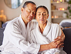 Hug, relax and mature couple at a spa with zen, calm and stress free mindset before a treatment. Man and woman embracing with love while relaxing at luxury health, wellness and beauty salon together.