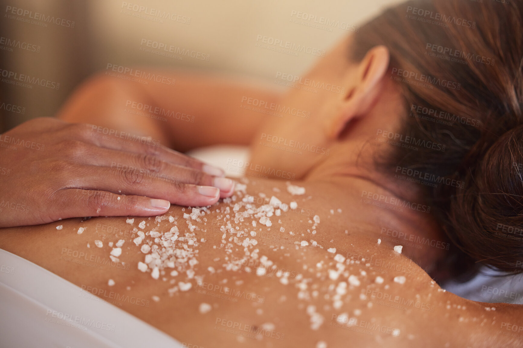 Buy stock photo Skincare, spa and woman with salt, luxury and massage back at resort. Female enjoy scrubbing, lady and beauty salon to relax, health and dermatology for exfoliating, skin wellness and natural care.