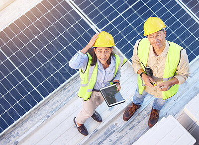 Buy stock photo Solar panels, digital tablet and top view of team doing maintenance, repairs or inspection. Solar energy, collaboration and portrait of industry workers on rooftop of building for photovoltaic cells.