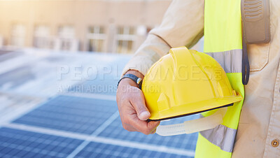 Buy stock photo Engineering, solar energy or hand with helmet for safety while working on photovoltaic development project. Industry hat, solar panels or construction worker working on building rooftop maintenance 