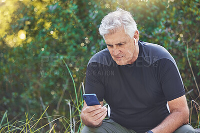 Buy stock photo Fitness, phone or old man streaming a podcast, radio music or motivational audio for running exercise or workout. Wellness, relaxing or senior person listening to a song in headphones in nature park