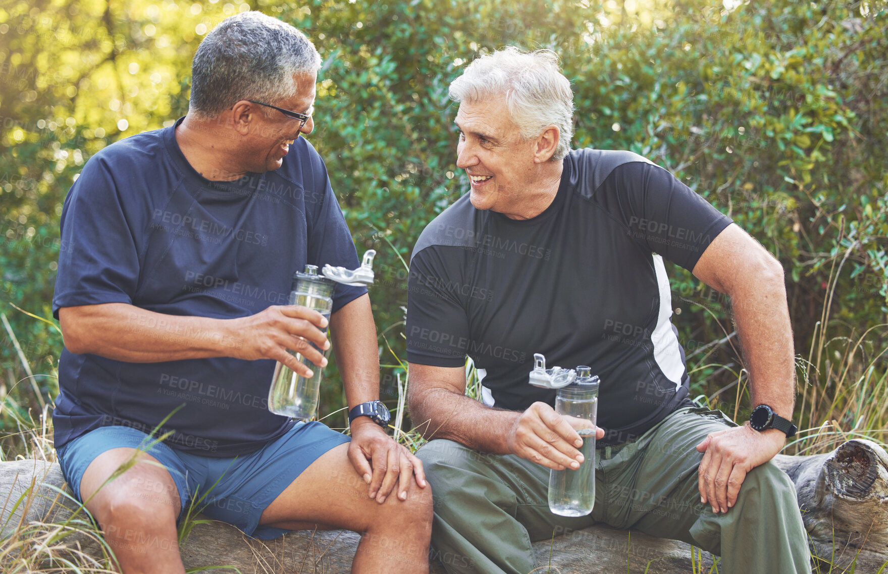 Buy stock photo Fitness, friends and elderly men relax after run in park with water bottle, hydration and break after exercise. Body workout, senior runner and conversation after workout outdoor, energy and happy.