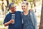 Exercise, senior couple in park and water bottle for training, workout and smile. Mature man, elderly woman and hydration for practice, cardio and energy for wellness, health and fitness in nature.