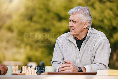 Buy stock photo Senior man, park and thinking for chess, game and competition at table by trees, sunshine and focus. Elderly chess player, outdoor and strategy for contest in nature, relax and play in Los Angeles