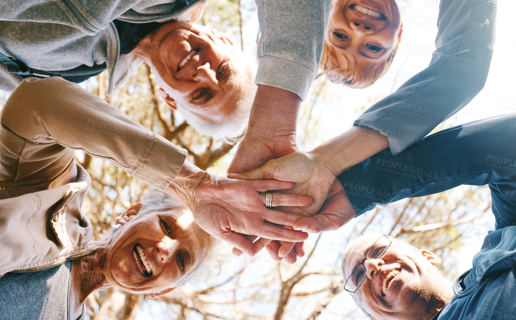 Buy stock photo Team work, hands or group of friends in nature for hiking, trekking or fitness training in nature forest. Senior, low angle or happy elderly people in partnership with support, trust or motivation