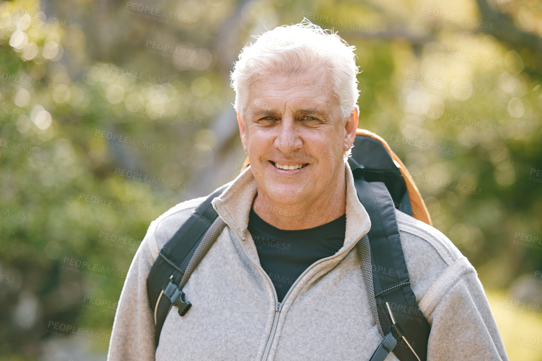 Buy stock photo Hiking, fitness and elderly man in nature for exercise and trekking in the park, vitality and active lifestyle portrait. Senior hiker, travel and adventure with retirement and wellness with cardio.