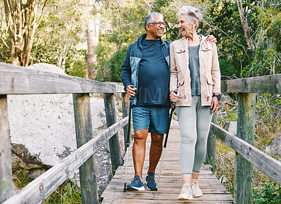 Buy stock photo Relax, senior or couple of friends hiking, walking or trekking for freedom, exercise or fitness in nature forest. Interracial, travel or happy woman enjoys bonding time with healthy elderly partner