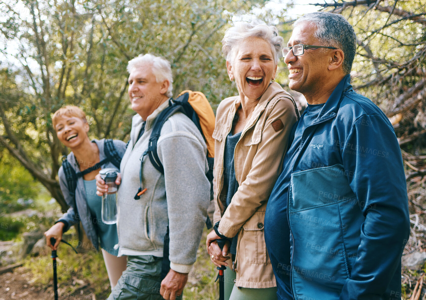 Buy stock photo Nature, hiking and happy senior friends bonding, talking and laughing at comic joke in forest. Happiness, fun and group of elderly people trekking together for health, wellness and exercise in woods.