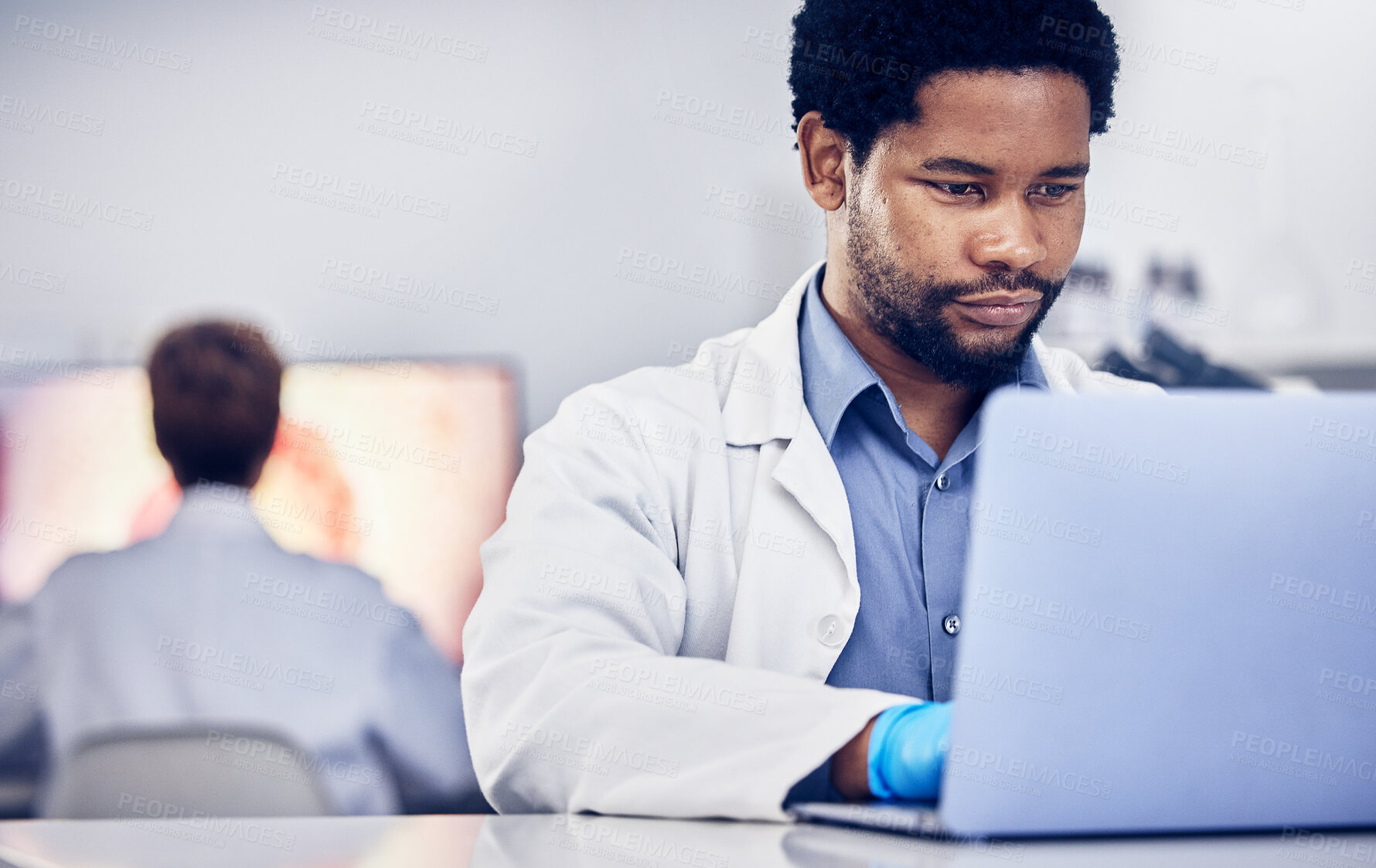 Buy stock photo Science, black man or laptop for typing, online research or laboratory for healthcare. Researcher, scientist or African American male with digital planning, update sample data or focus for innovation