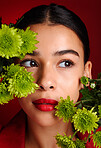 Face, woman and lipstick with beauty and flower aesthetic, natural cosmetic care with makeup and art against red studio background. Lips, skincare and organic cosmetics with wellness and microblading
