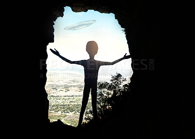 Buy stock photo Rearview shot of a young man standing at the top of a mountain with his arms outstretched