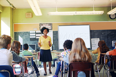 Buy stock photo Black woman, teacher and classroom with students for education, learning support and knowledge development. African female, preschool classroom and academic discussion or teaching young children 