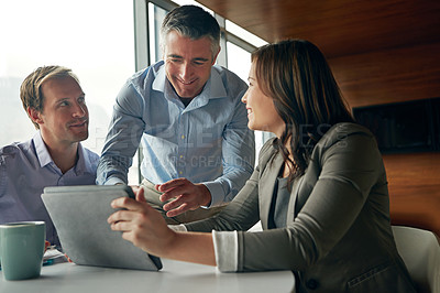 Buy stock photo Business people, tablet and meeting discussion for idea, strategy or planning together at the office. Group of employee workers in business meeting working on touchscreen for marketing or advertising