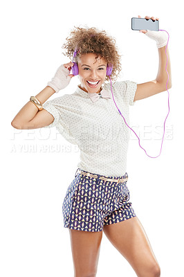 Buy stock photo Happy, dancing and woman portrait of a model with music, phone radio and web song. White background, black woman and happiness of isolated person streaming a podcast with headphones and mobile