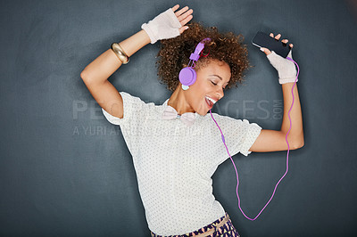 Buy stock photo Phone music, dancing singer and black woman listening to song, audio podcast or radio sound for energy, relief or fun. Studio singing, dancer or retro dance student isolated on chalkboard background 