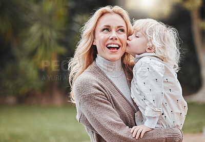 Buy stock photo Shot of a woman and her adorable son spending time outdoors