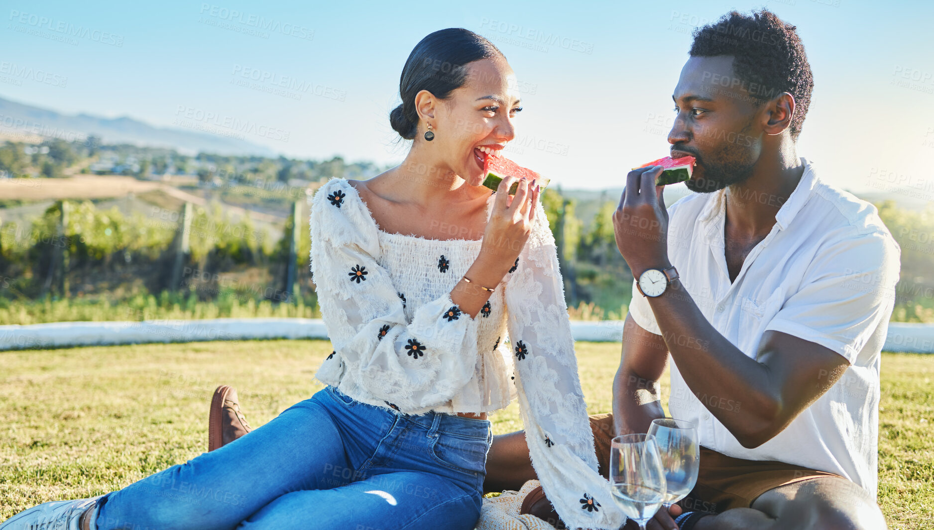 Buy stock photo Watermelon, love or black couple on a picnic to relax on a summer holiday vacation in nature or grass. Partnership, romance or happy black woman enjoys traveling or bonding with a funny black man 