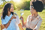 Black woman, friends and toast in park at picnic with glass, drinks or champagne for happiness in sunshine. Women, happy and celebration in summer, relax and smile together at outdoor party on grass