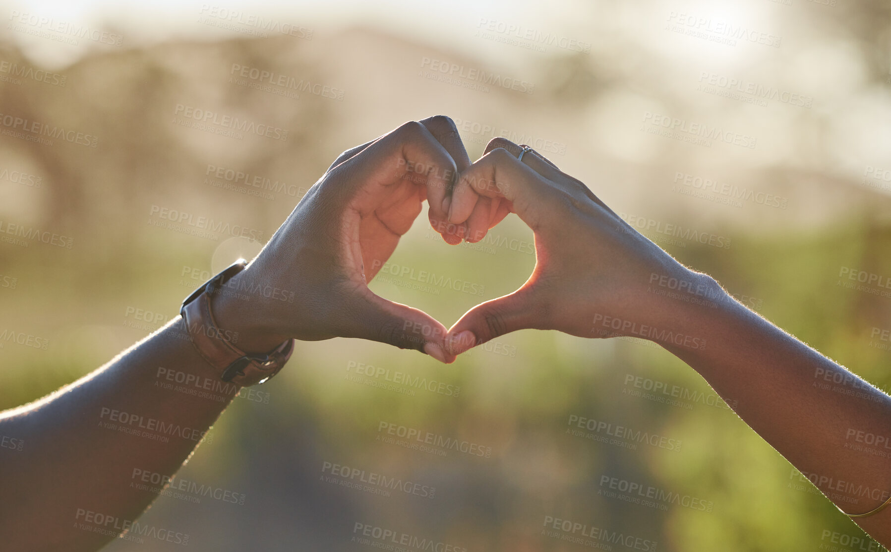 Buy stock photo Heart, love hands and black couple in nature on holiday, trip or vacation. Romance, affection emoji and man and woman with sign or gesture for support, trust and care outdoors together on a date.