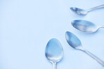 Kitchen, cutlery and spoon on a table as a group with mockup to represent community, charity or donation. Cooking, metal and space with steel utensils on a surface from above to volunteer or donate